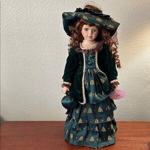 Collector Porcelain Doll in Dark Green Satin Dress with Gold Details